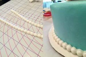 Wilton course 4 - Applying pearl border to cake